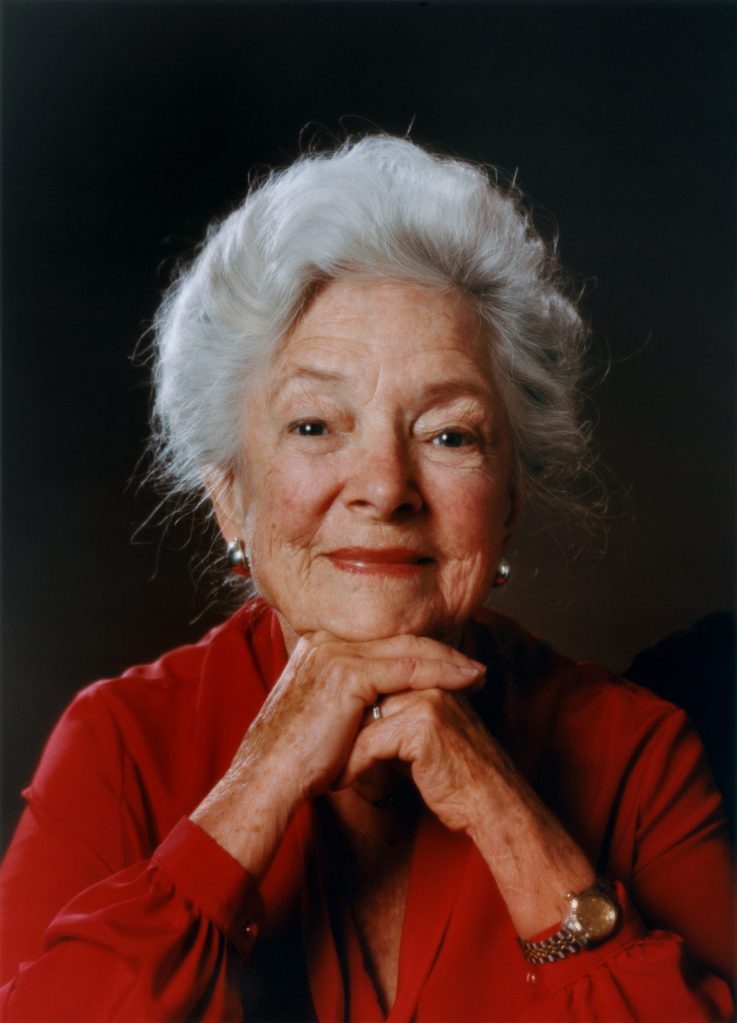 A color portrait of an older Helen Hayes, looking directly to camera.