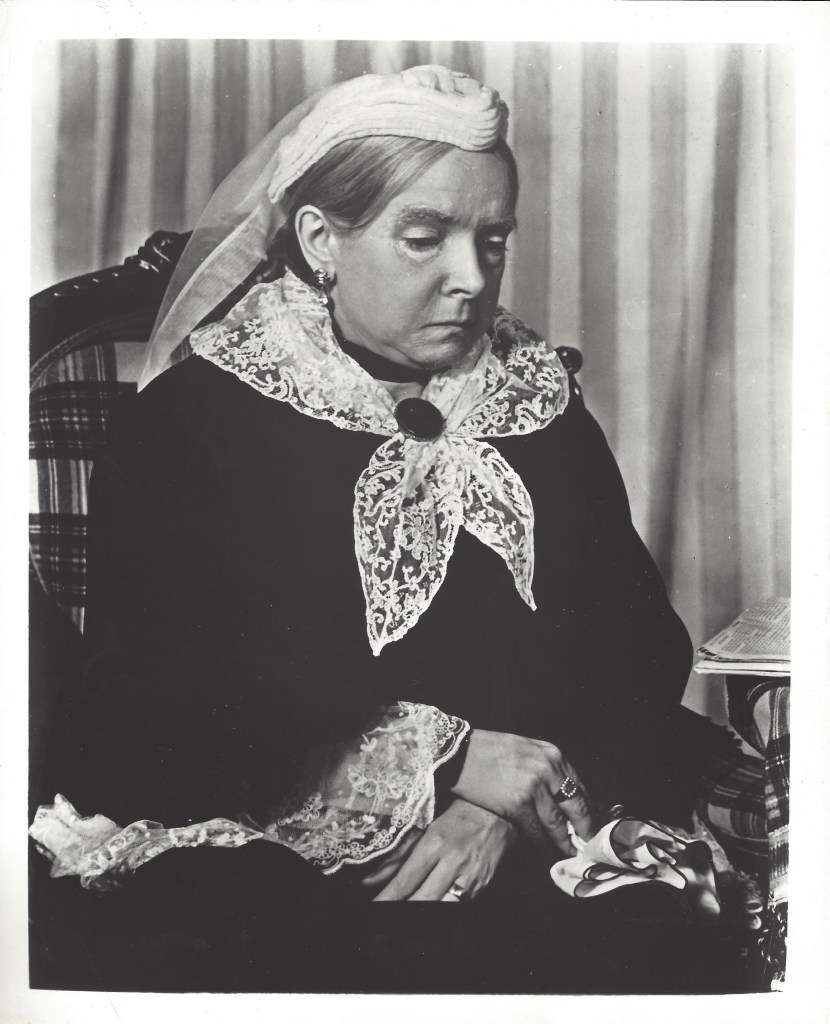 A black and white photograph of Helen Hayes in old age makeup as Queen Victoria.