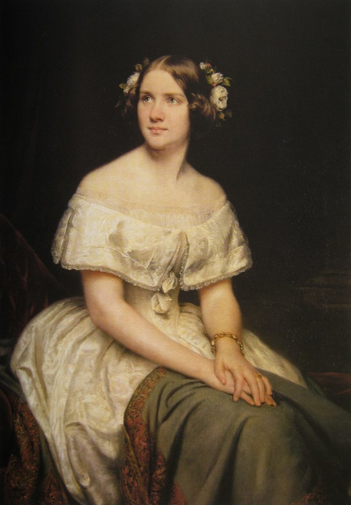 Color portrait of Jenny Lind, seated with her hands on her lap.